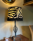 Zebra print velboa french drum lampshade, with black fringe and braid