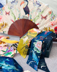 Floral Silk Fan with Toucan design and luxurious Gold tassel, part of the Mysa Collection