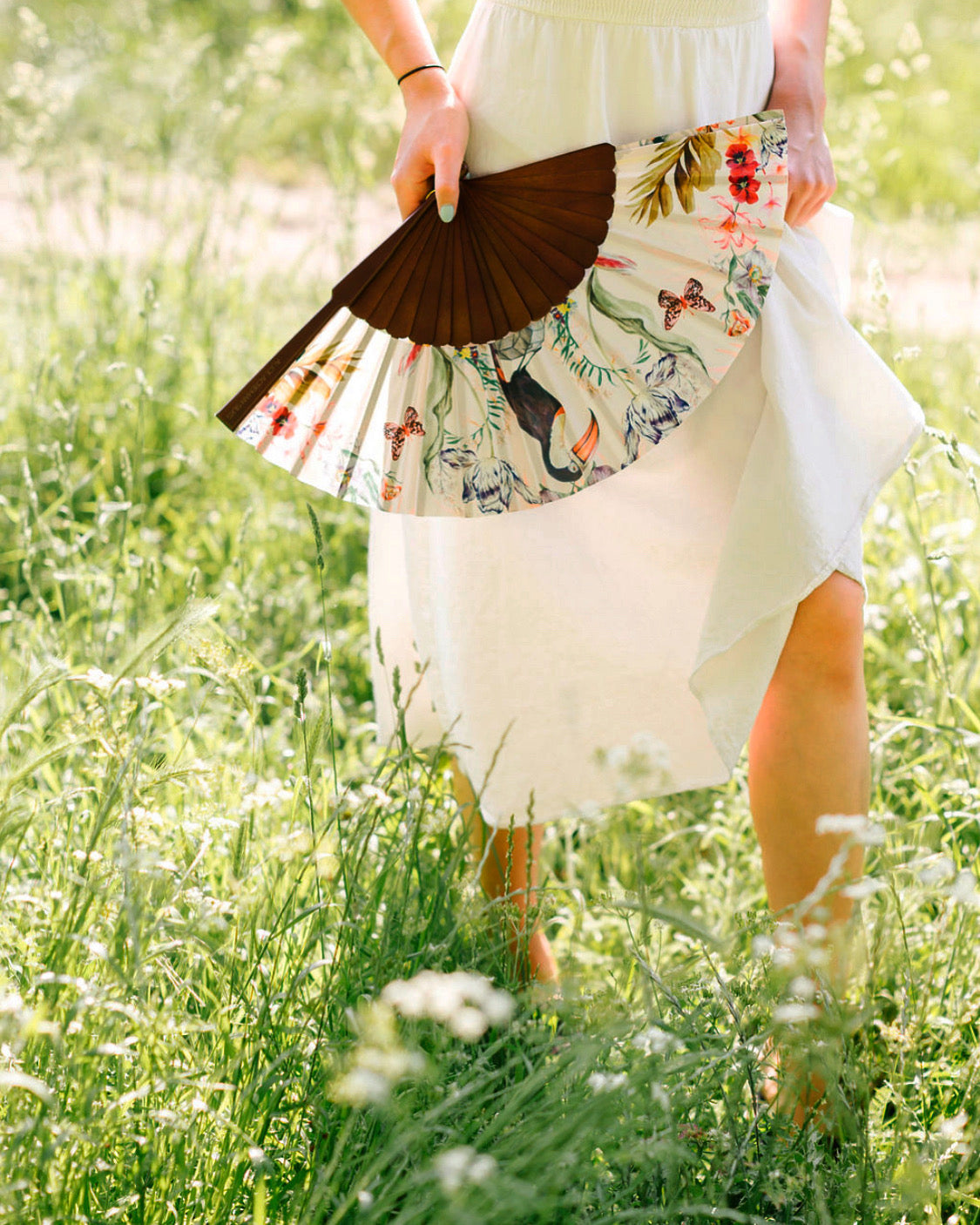 Floral Silk Fan with Toucan design and luxurious Gold tassel, part of the Mysa Collection