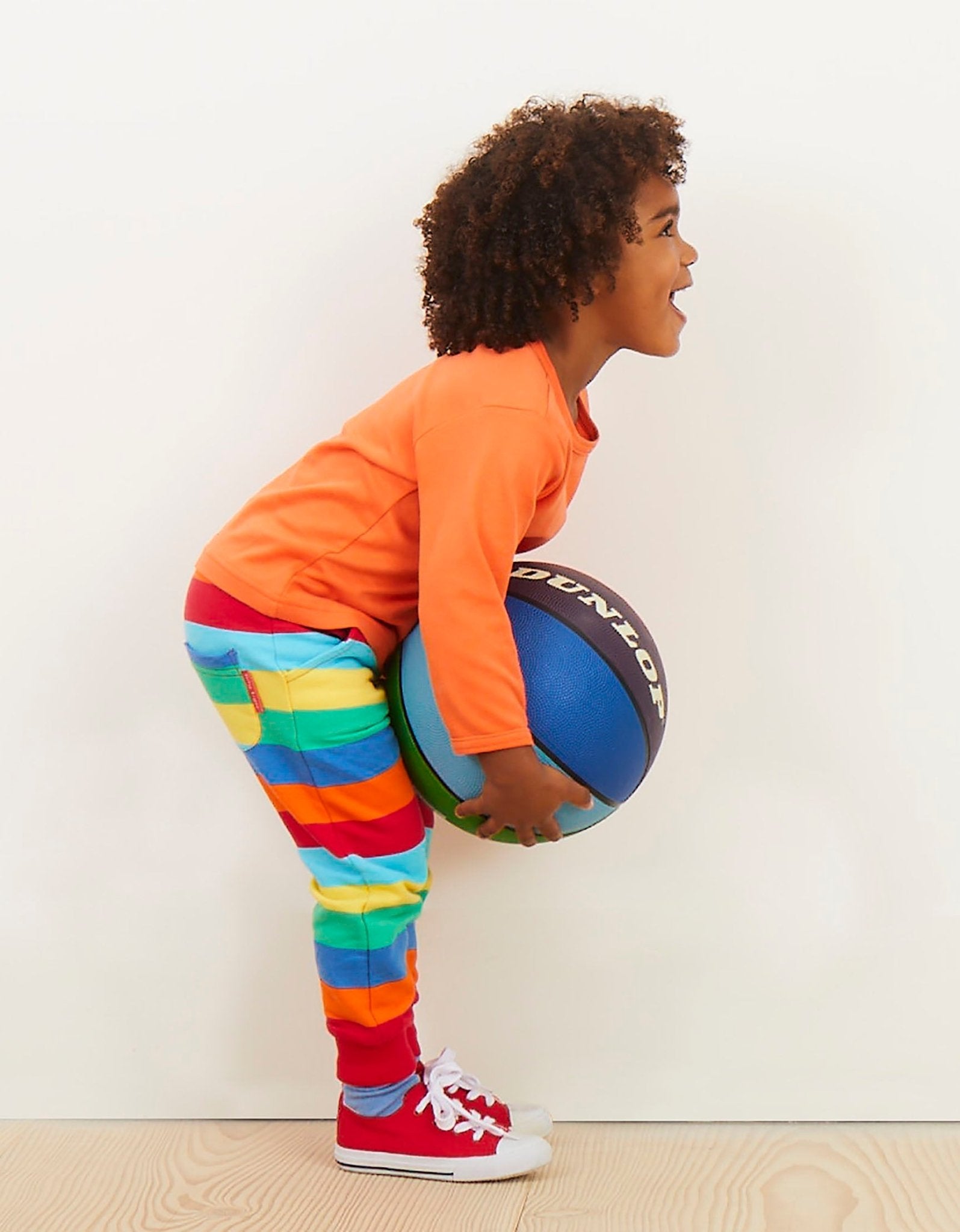 Premium striped organic cotton kids jogging pants, soft cozy fabric with stretch cuffs, trendy bright colors, best-selling comfy lounge wear by Toby Tiger at brixbailey.com