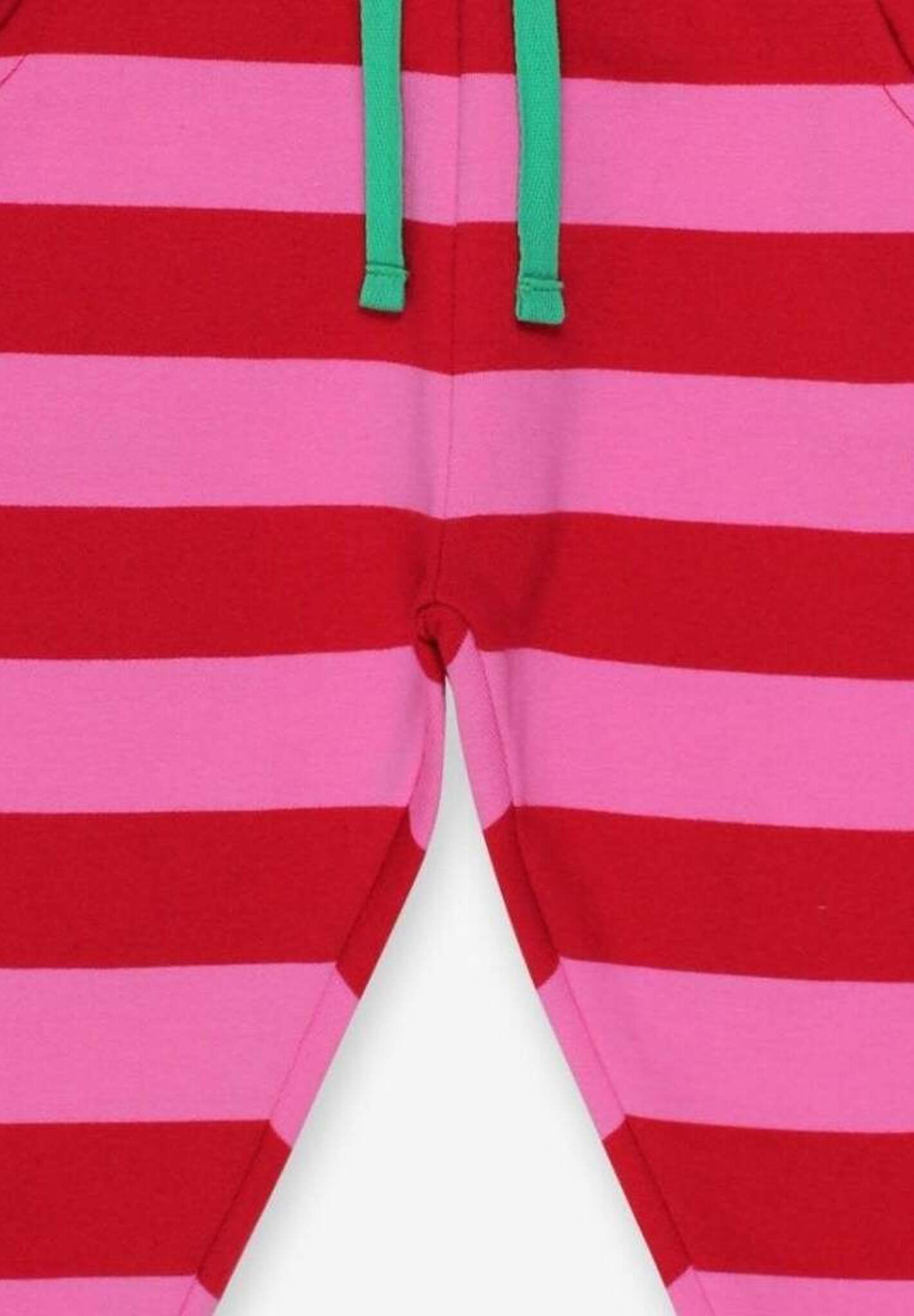 Premium striped baby joggers in pink and red, organic cotton, stylish and comfortable for playtime by Toby Tiger at brixbailey.com