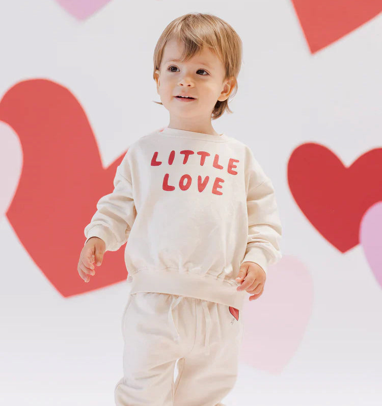 Child wearing a playful, independent brand outfit available at Brix and Bailey Marketplace.

