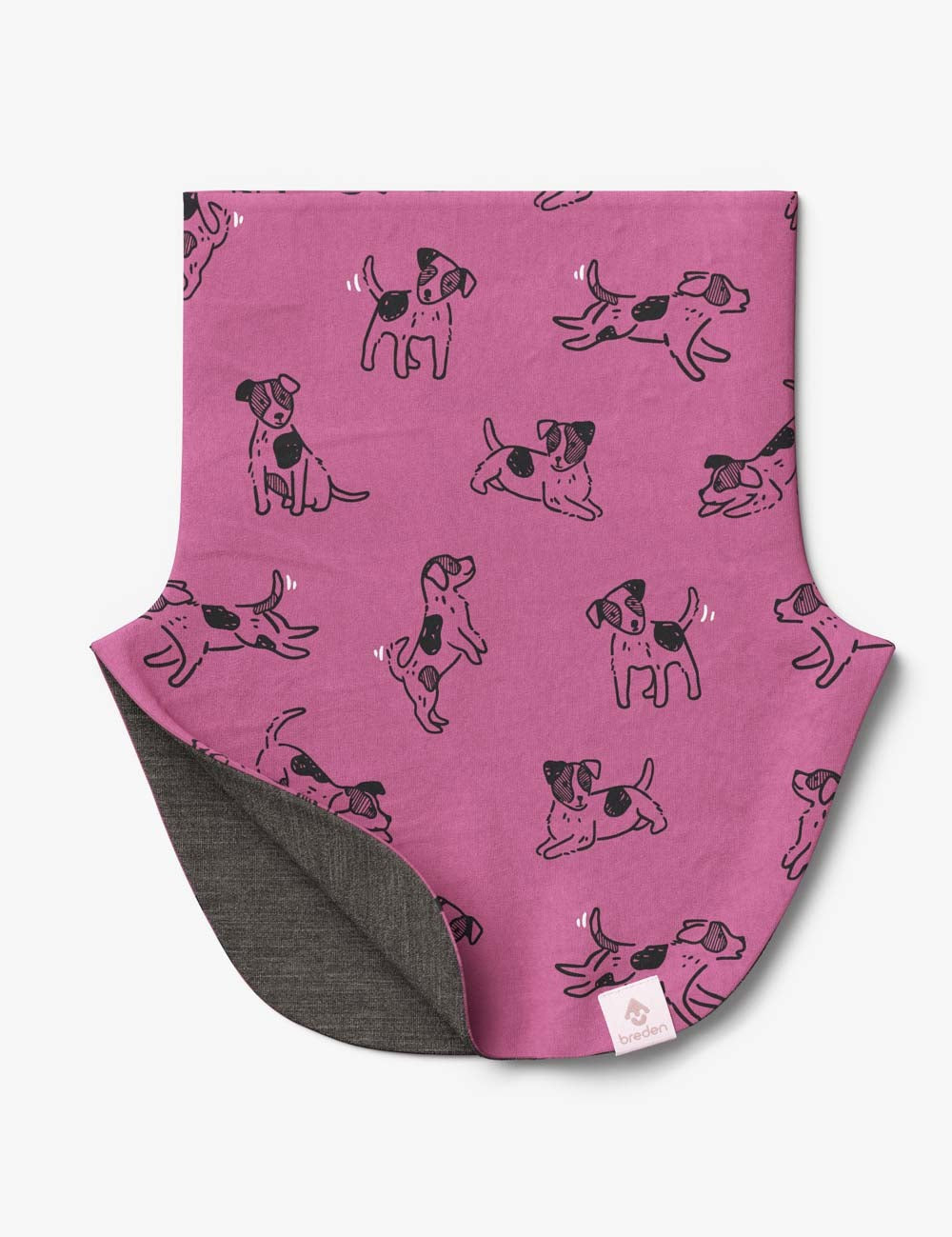 bold close-up of a kids merino neck warmer with playful pink dogs on a vibrant background
