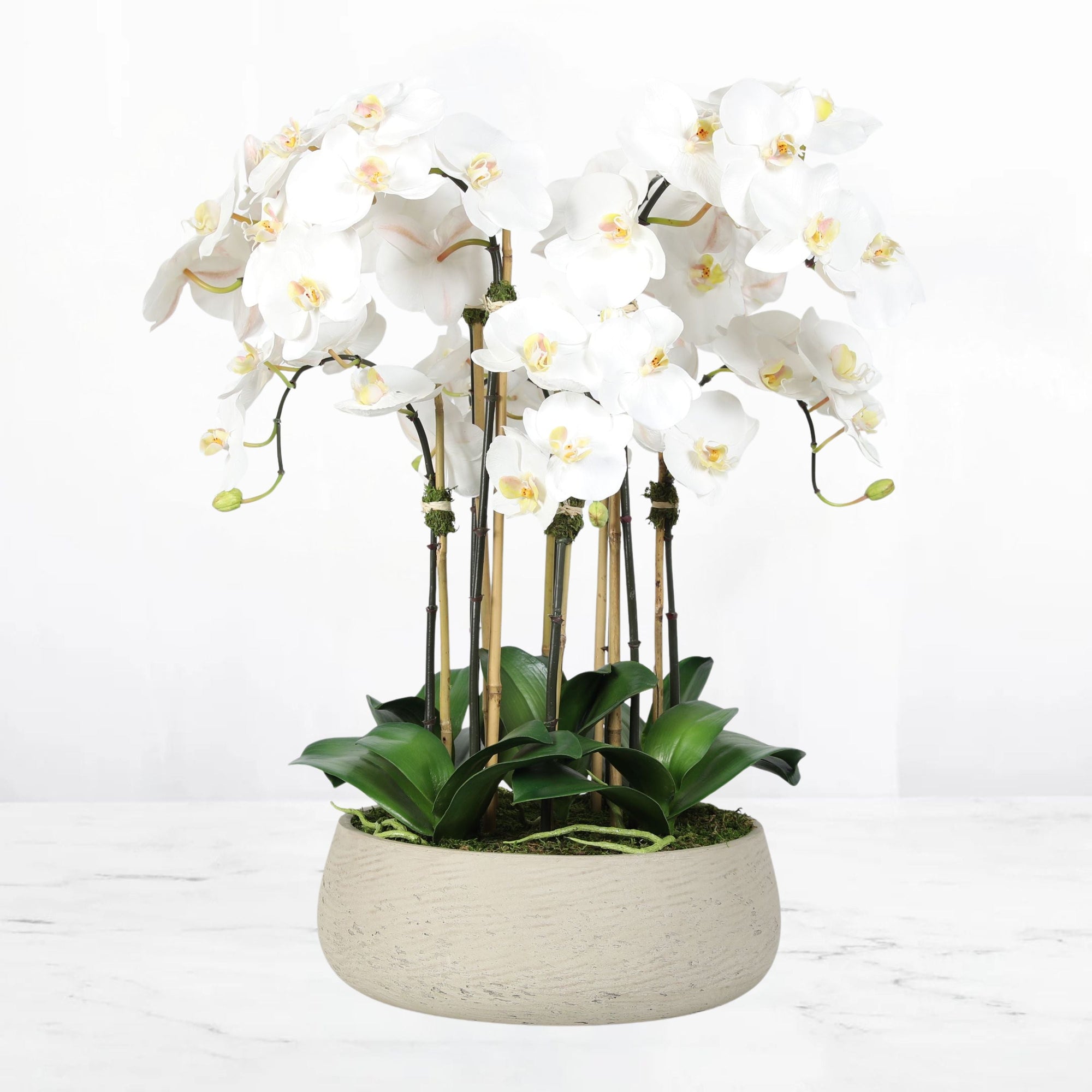 Artificial orchid centerpiece arrangement in beige planter - 28"
