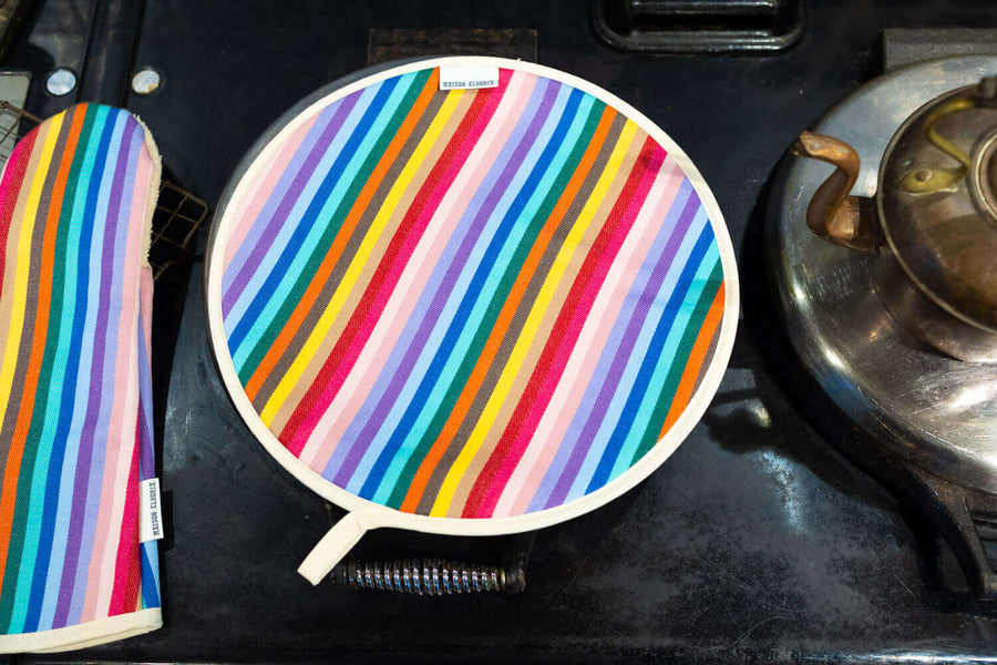 Premium rainbow chef pad for Aga range cooker, handmade heat-retaining hob cover in UK-woven organic cotton, stylish and protective by Maison Elhoria at brixbailey.com