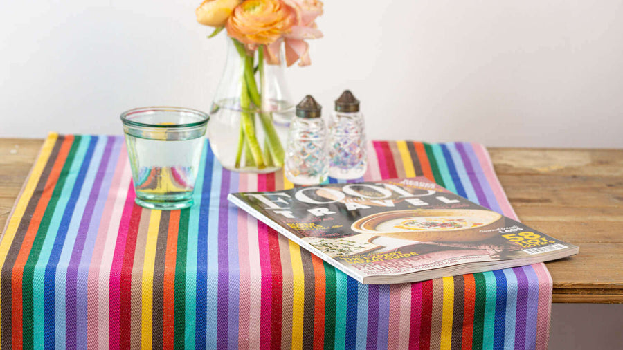 Luxury rainbow table runner, 100% cotton recycled organic, handcrafted in England, stylish 2.5m long, best-selling party decor by Maison Elhoria at brixbailey.com