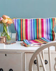 Premium rainbow toiletry bag, luxury British woven organic cotton, waterproof lining, durable zip, versatile for baby essentials, recycled yarns, washable by Maison Elhoria at brixbailey.com