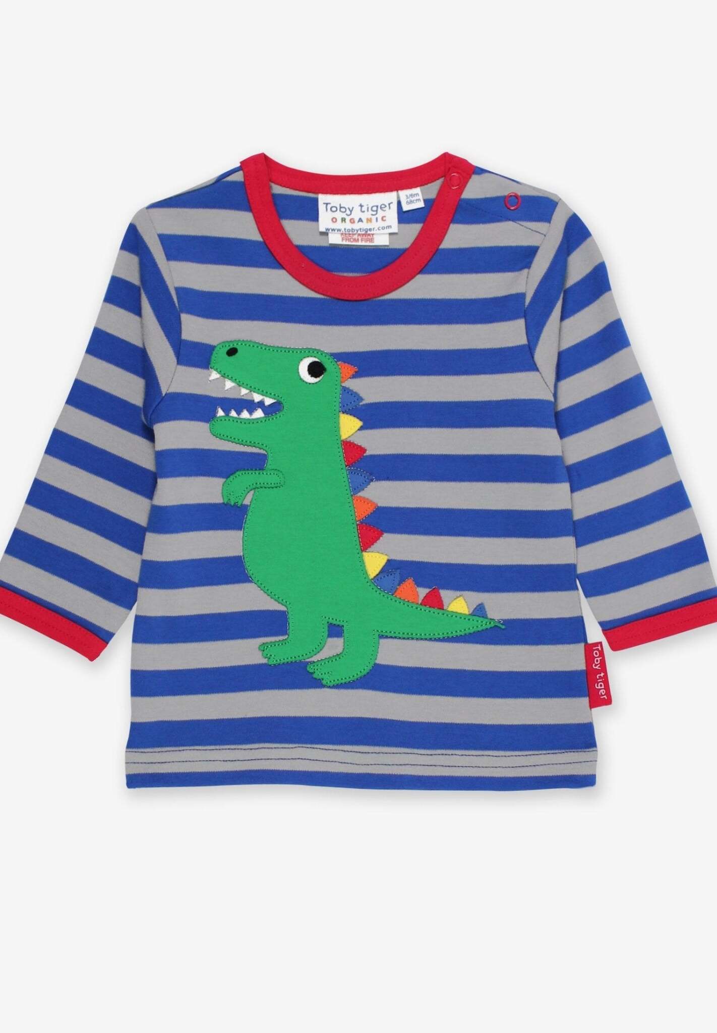 Premium organic cotton long sleeve shirt with T-Rex dinosaur applique, soft striped kids top with rainbow spikes and snap buttons by Toby Tiger at brixbailey.com