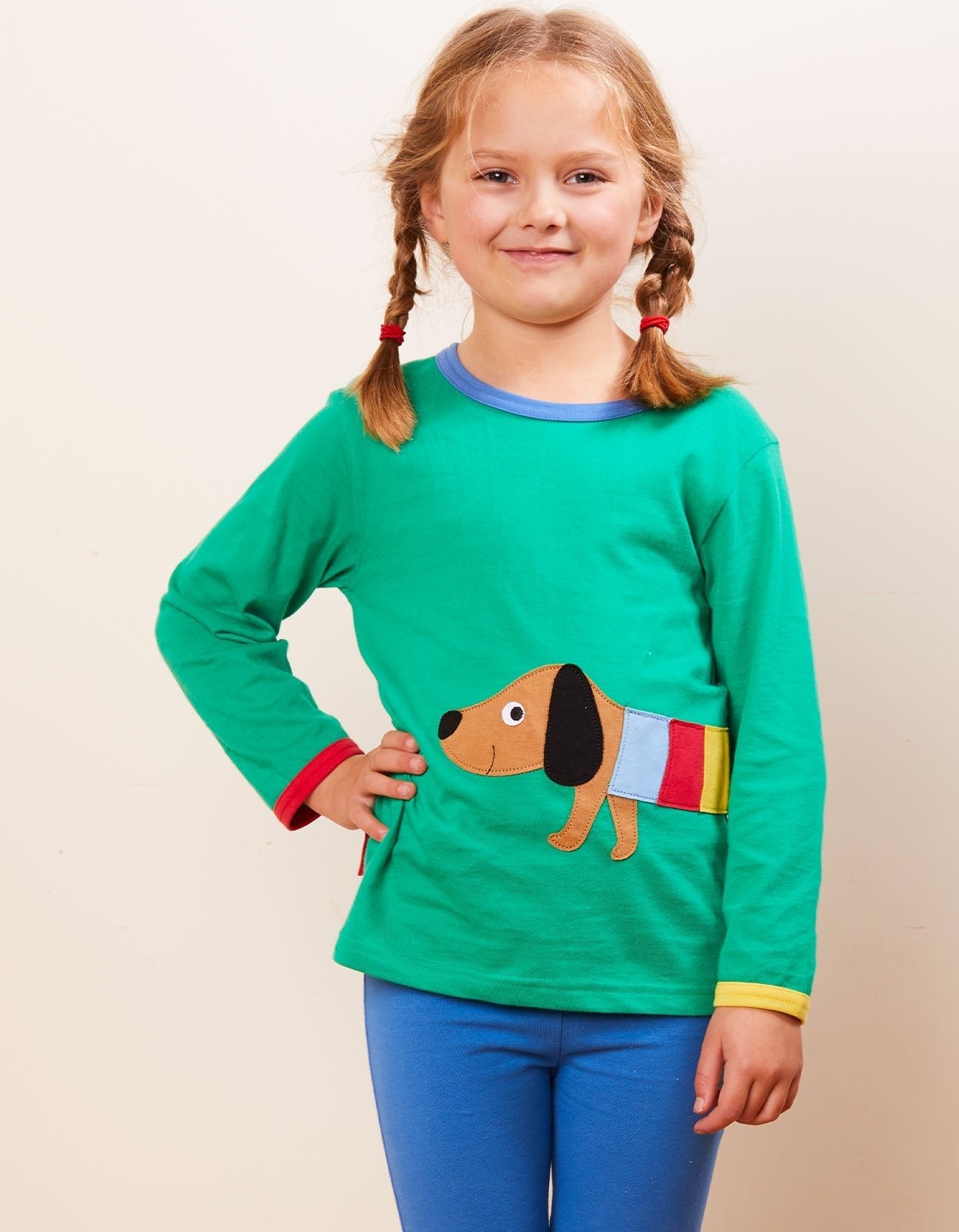 Premium organic cotton long sleeve green t-shirt with stylish dachshund applique, rainbow jacket, GOTS certified, soft and comfortable, sizes 6-24 months by Toby Tiger at brixbailey.com
