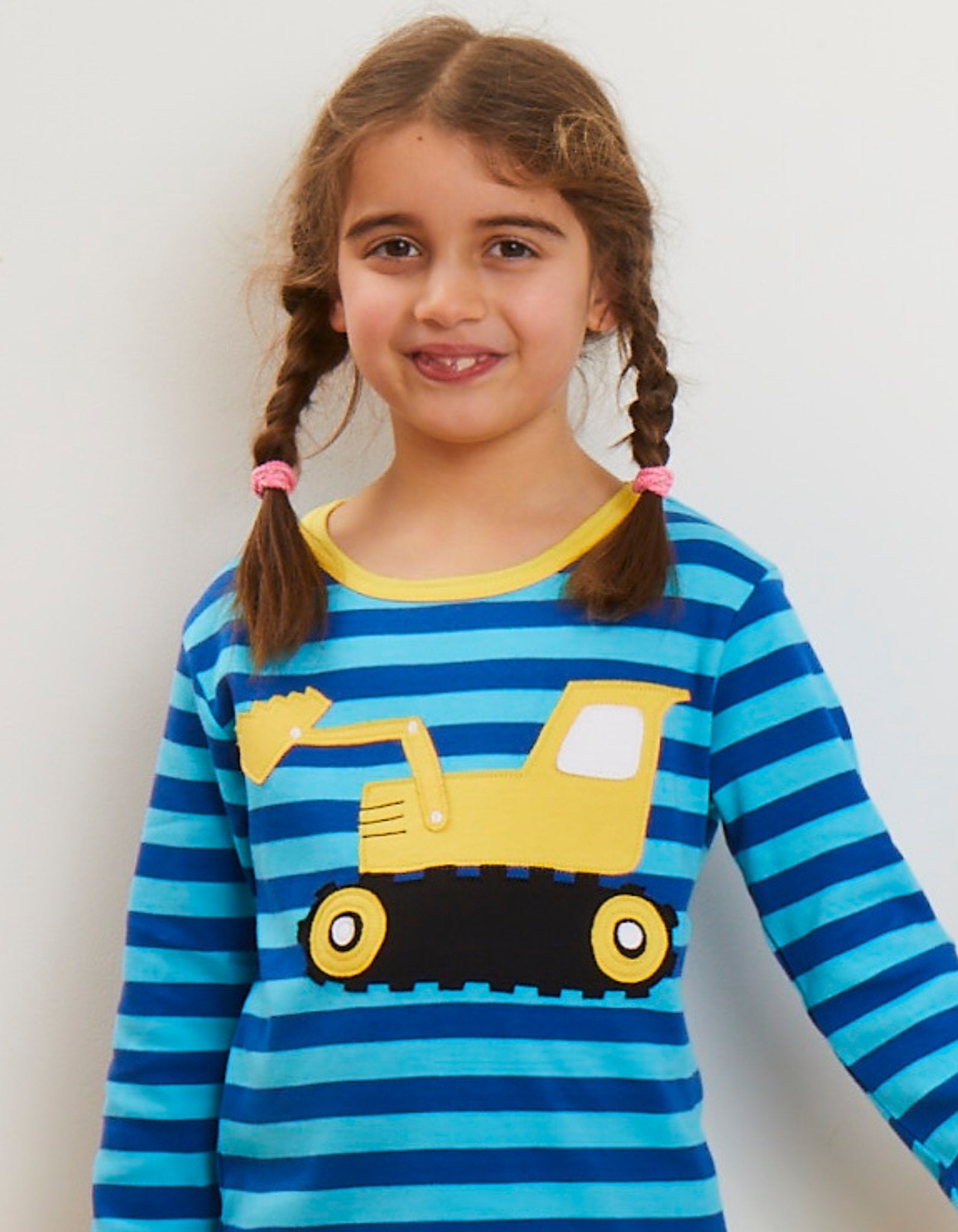 Premium organic cotton striped long sleeve baby shirt with soft digger applique, GOTS certified, snap buttons for easy dressing by Toby Tiger at brixbailey.com