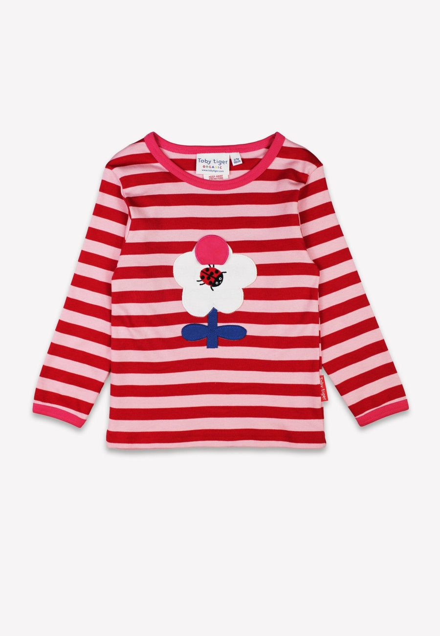Vibrant Flower Power Pink Striped Organic Cotton Long Sleeve Shirt with Retro Floral Applique and Interactive Ladybug Flap by Toby Tiger at brixbailey.com