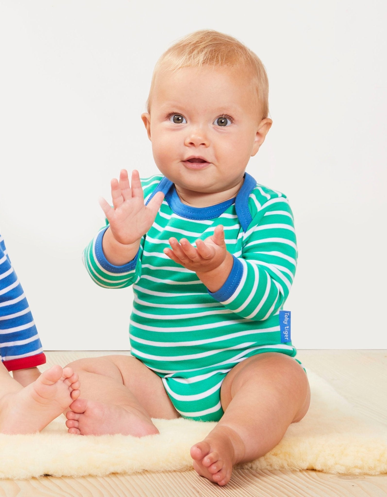 Premium Green and White Striped Long Sleeve Baby Bodysuit with Snap Buttons and Slip Neck, GOTS Certified Organic Cotton by Toby Tiger at brixbailey.com