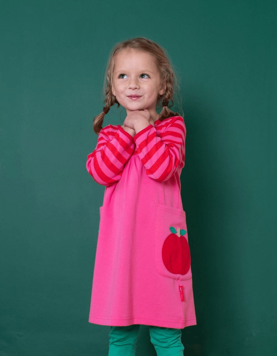 Stylish Long Sleeve Organic Kids Dress with Fun Apple Appliques and Pink Pockets by Toby Tiger at brixbailey.com