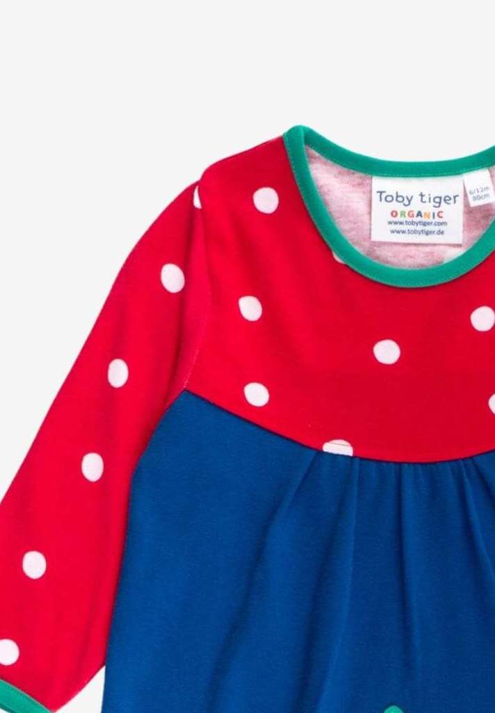 Premium dark blue Christmas dress with penguin applique, long sleeves, red-white polka dot yoke, GOTS certified organic cotton by Toby Tiger at brixbailey.com