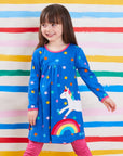 Dreamy Unicorn Rainbow and Star Print Dress for Babies in Soft Organic Cotton with Snap Buttons and Long Sleeves by Toby Tiger at brixbailey.com