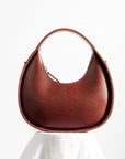 Elegant Mini Moon Sling Bag – Versatile & Stylish Leather by Craftory at brixbailey.com