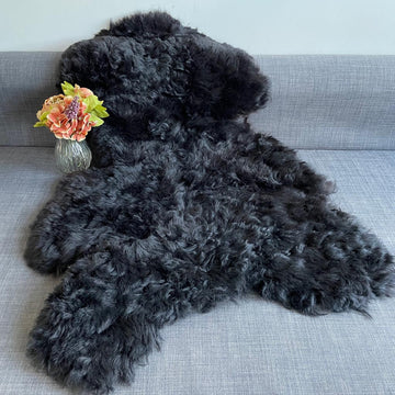 Luxury natural black Icelandic sheepskin rug, premium undyed shorn 50mm sheep hide, best-selling hypoallergenic free-range throw by Wildash London at brixbailey.com