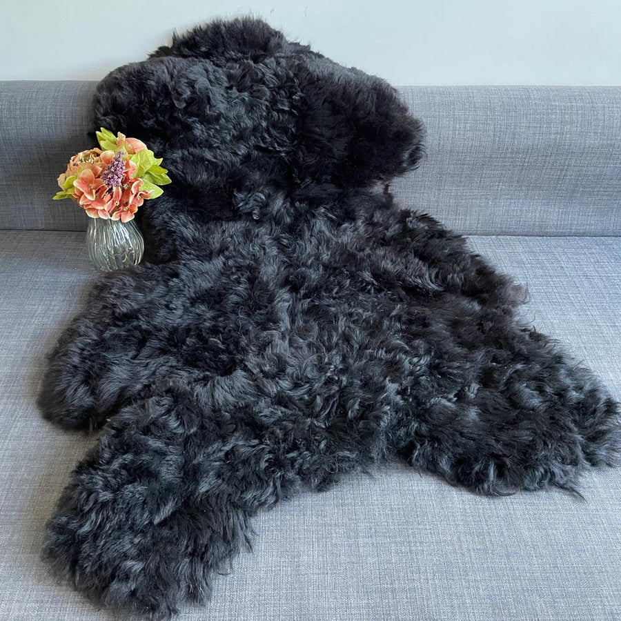 Luxury natural black Icelandic sheepskin rug, premium undyed shorn 50mm sheep hide, best-selling hypoallergenic free-range throw by Wildash London at brixbailey.com
