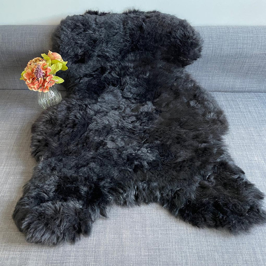Luxury natural black Icelandic sheepskin rug, premium undyed shorn sheep hide, soft hypoallergenic fur, best-selling organic free-range throw by Wildash London at brixbailey.com