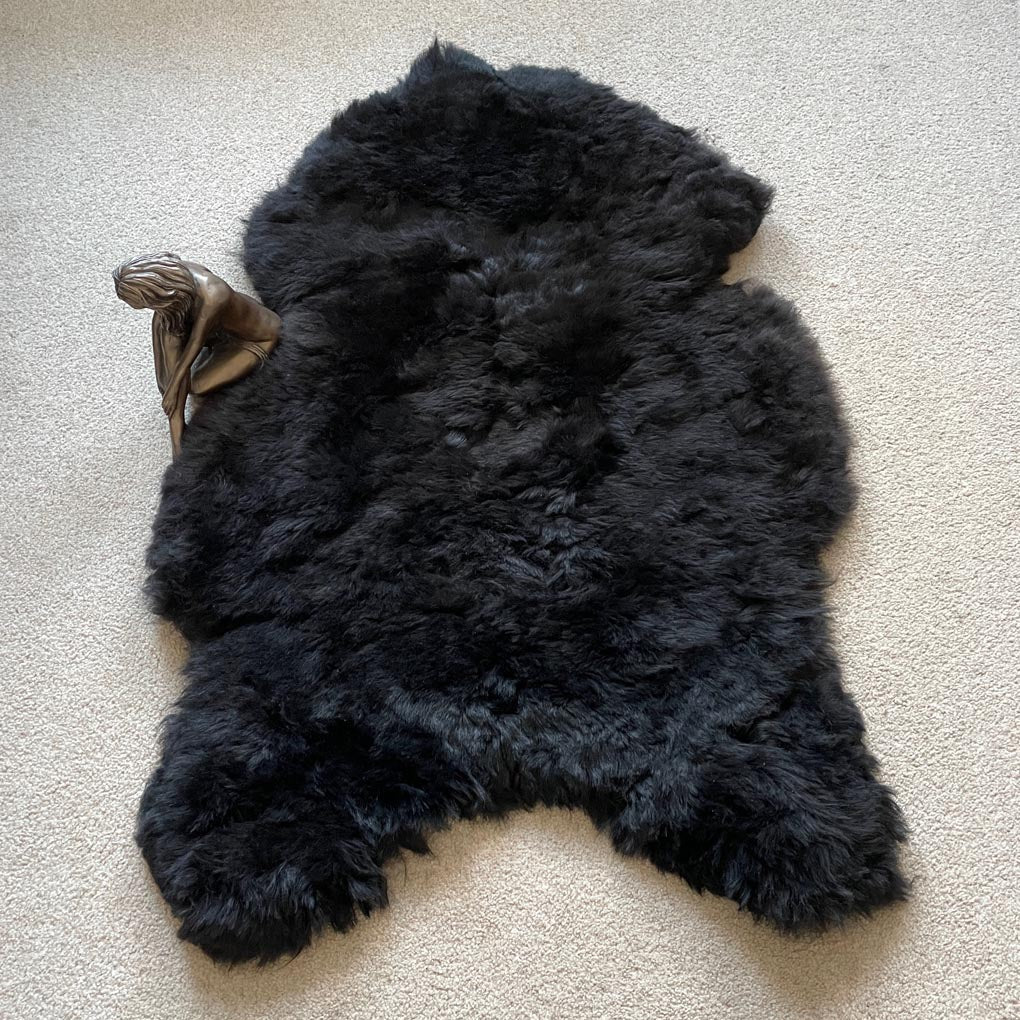 Luxury natural black Icelandic sheepskin rug, premium undyed shorn 50mm sheep hide, authentic free-range hypoallergenic fur, best-selling sustainable decor by Wildash London at brixbailey.com