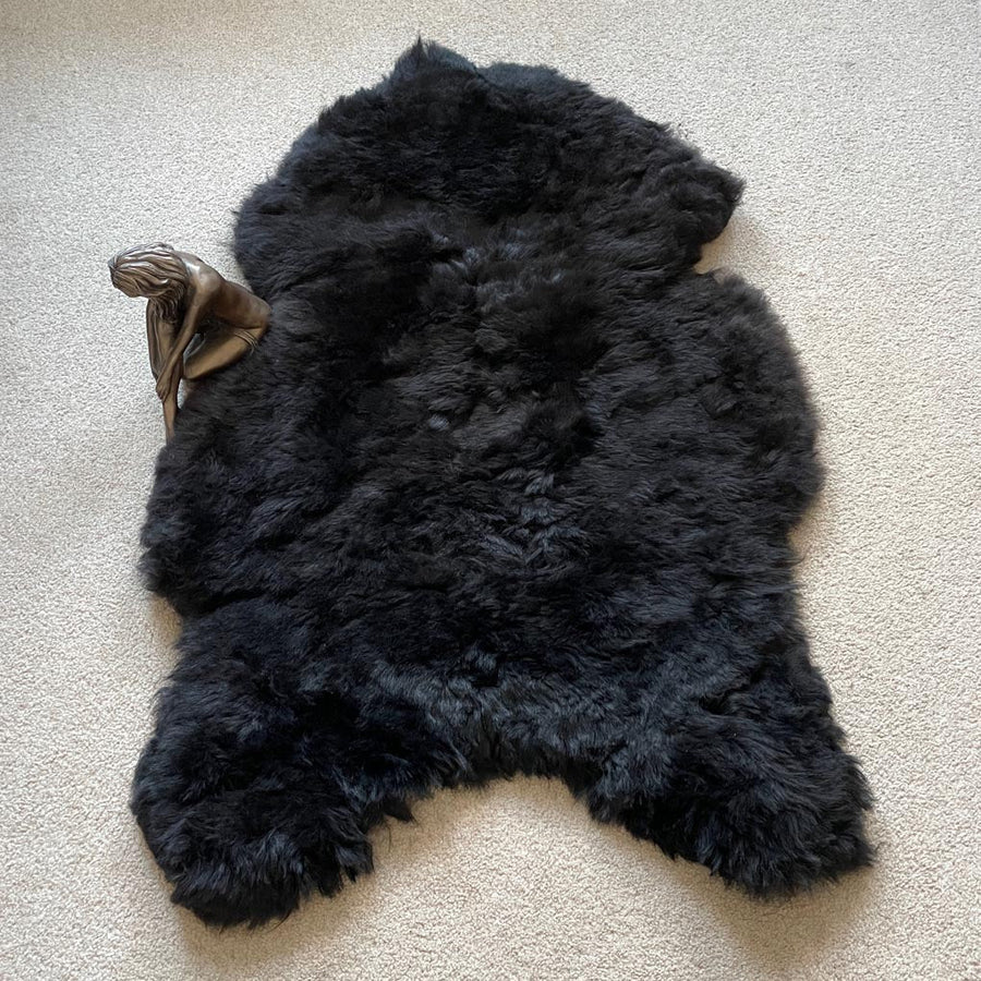 Luxury natural black Icelandic sheepskin rug, premium undyed shorn 50mm sheep hide, authentic free-range hypoallergenic fur, best-selling sustainable decor by Wildash London at brixbailey.com