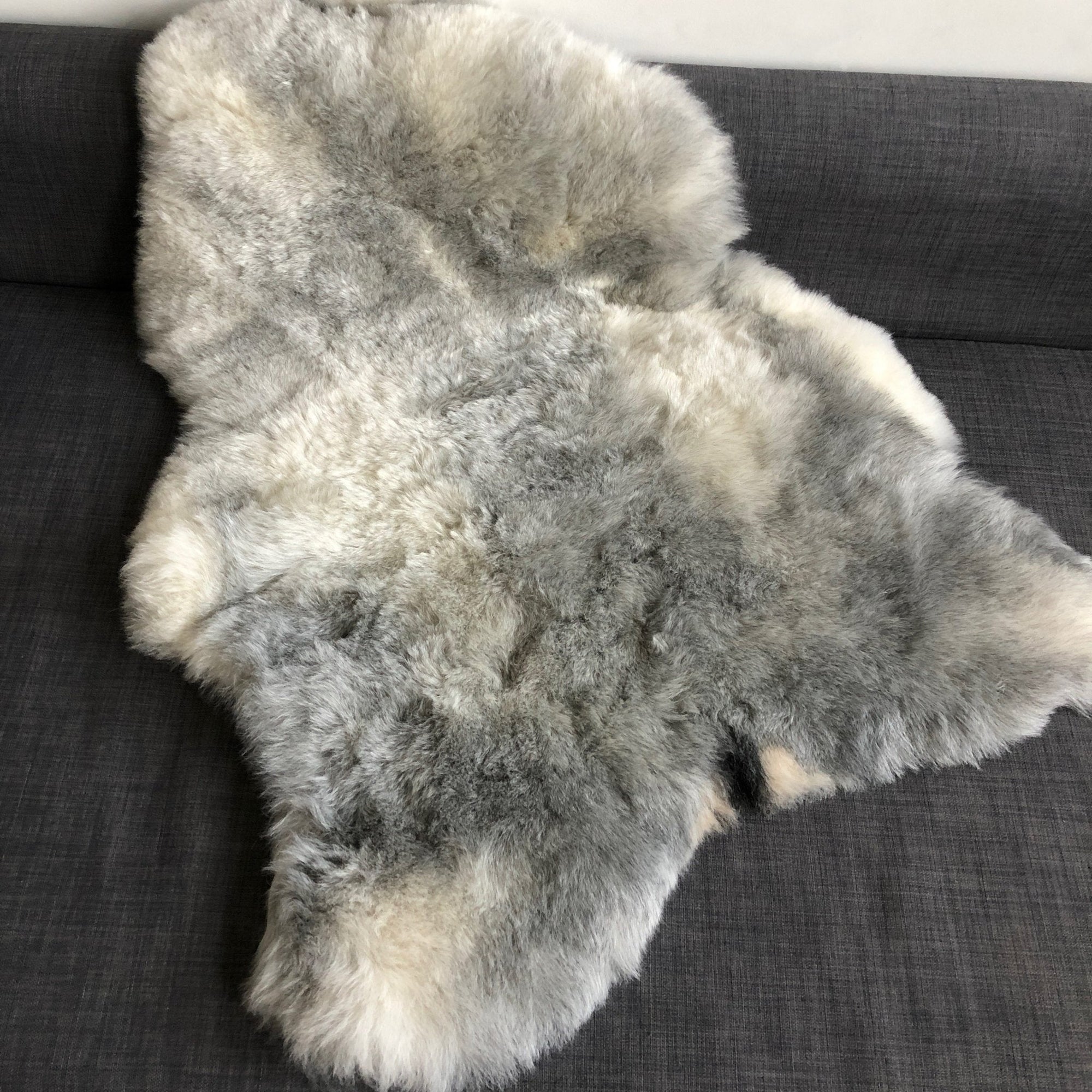 Luxury natural grey Icelandic sheepskin rug, premium shorn 50mm sheep hide, ethically sourced free-range wool, best-selling authentic sheepskin throw by Wildash London at brixbailey.com