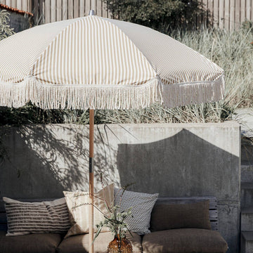 Luxury sand and white pinstripe parasol, vintage-inspired with durable cotton-polyester fabric and beechwood pole by Ella James at brixbailey.com