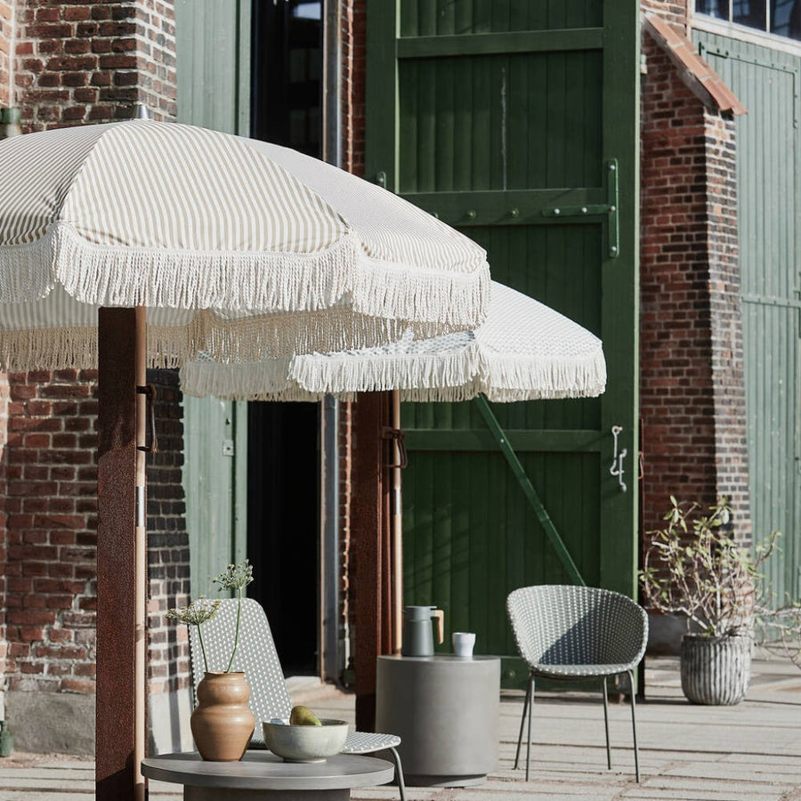 Luxury sand and white pinstripe parasol, premium vintage-style garden umbrella with beechwood pole and fringe by Ella James at brixbailey.com