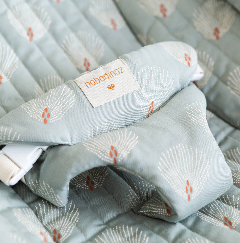 Premium Growing Green Baby Bouncer with Blue Peacock Feather Print, Organic Cotton Cover, Beechwood Frame, Handmade Quilted Finish by Ella James at brixbailey.com