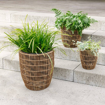 Premium outdoor rattan effect planter, stylish synthetic woven design, weatherproof and water-resistant, includes plastic inner pot with drainage hole, available in three sizes by Ella James at brixbailey.com