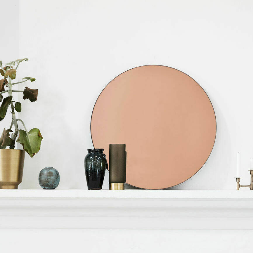 Luxury Danish rose gold tint mirror, classic design with warm atmospheric glow by Ella James at brixbailey.com
