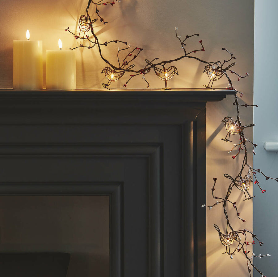Luxury battery-operated LED robin garland with 12 dainty wire birds, warm white lights, and faux winter berries by Ella James at brixbailey.com