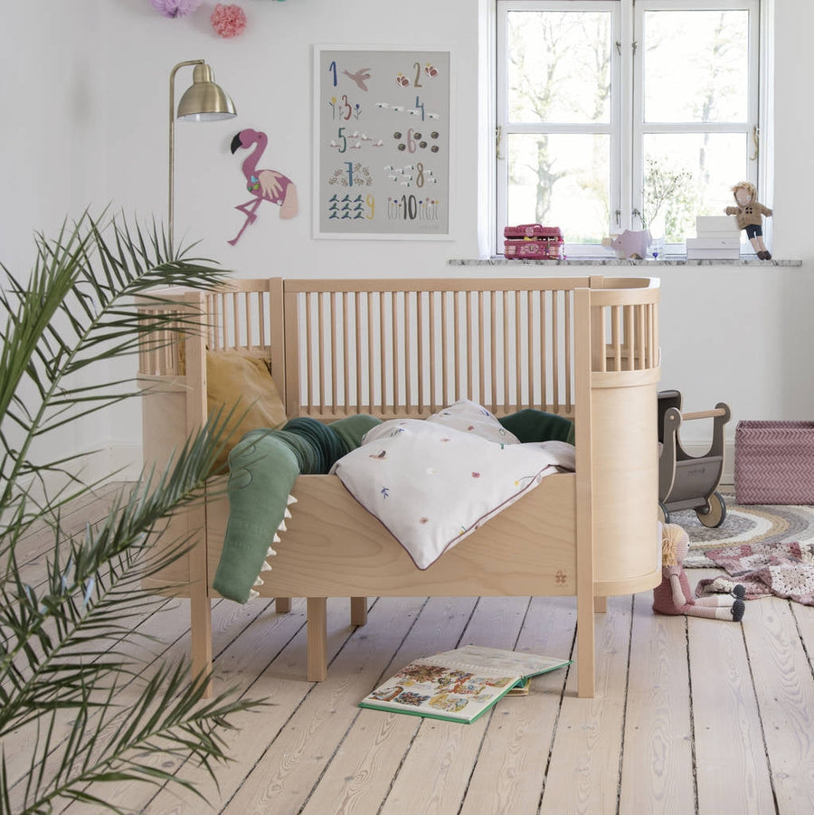 Sebra wooden baby and junior cot bed, luxury height-adjustable convertible crib, premium handcrafted Danish design, best-selling toddler bed by Ella James at brixbailey.com
