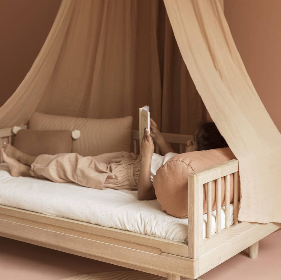 Luxury Nobodinoz solid oakwood junior bed, premium low-level design, stylish 50s rounded legs, best-selling timeless piece for kids by Ella James at brixbailey.com