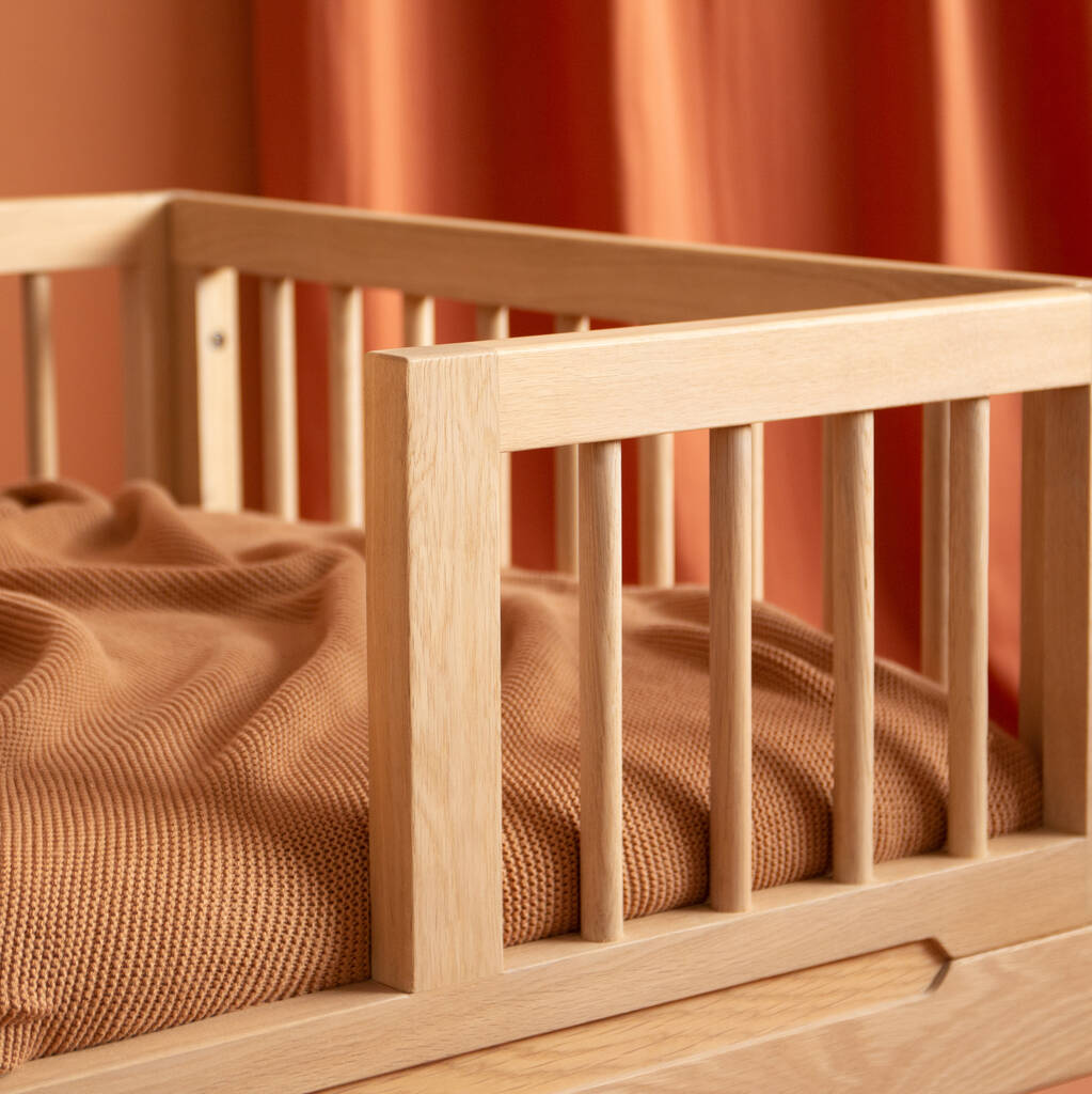 Luxury Nobodinoz solid oakwood junior bed, premium handcrafted transition bed for kids, stylish low-level design with adjustable height by Ella James at brixbailey.com