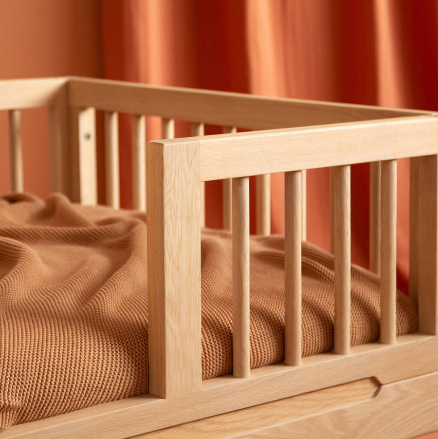 Luxury Nobodinoz solid oakwood junior bed, premium handcrafted transition bed for kids, stylish low-level design with adjustable height by Ella James at brixbailey.com