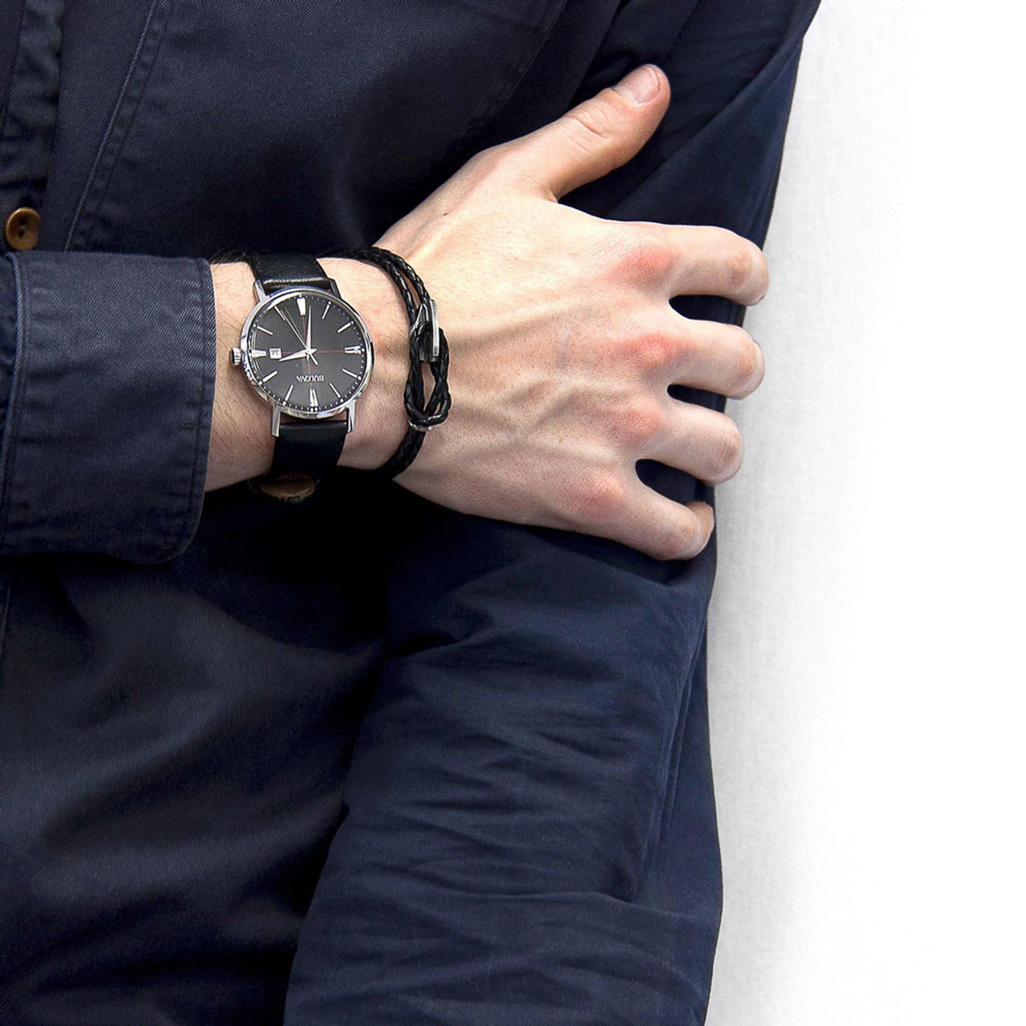 Man wearing a statement watch and bracelet from the Brix + Bailey marketplace, featuring independent brands.