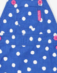 Premium blue corduroy pinafore dress with white polka dots, soft organic cotton, adjustable straps, front pocket, machine washable by Toby Tiger at brixbailey.com