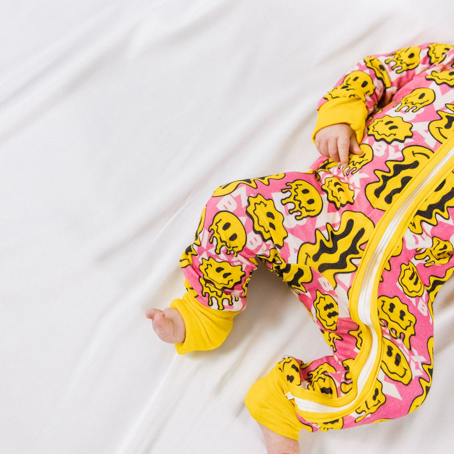 Trippy Smiles Pink Bamboo Zip Onesie - Buttery Soft Baby Sleeper with Fold Over Hands & Feet by NIXX BABY at brixbailey.com