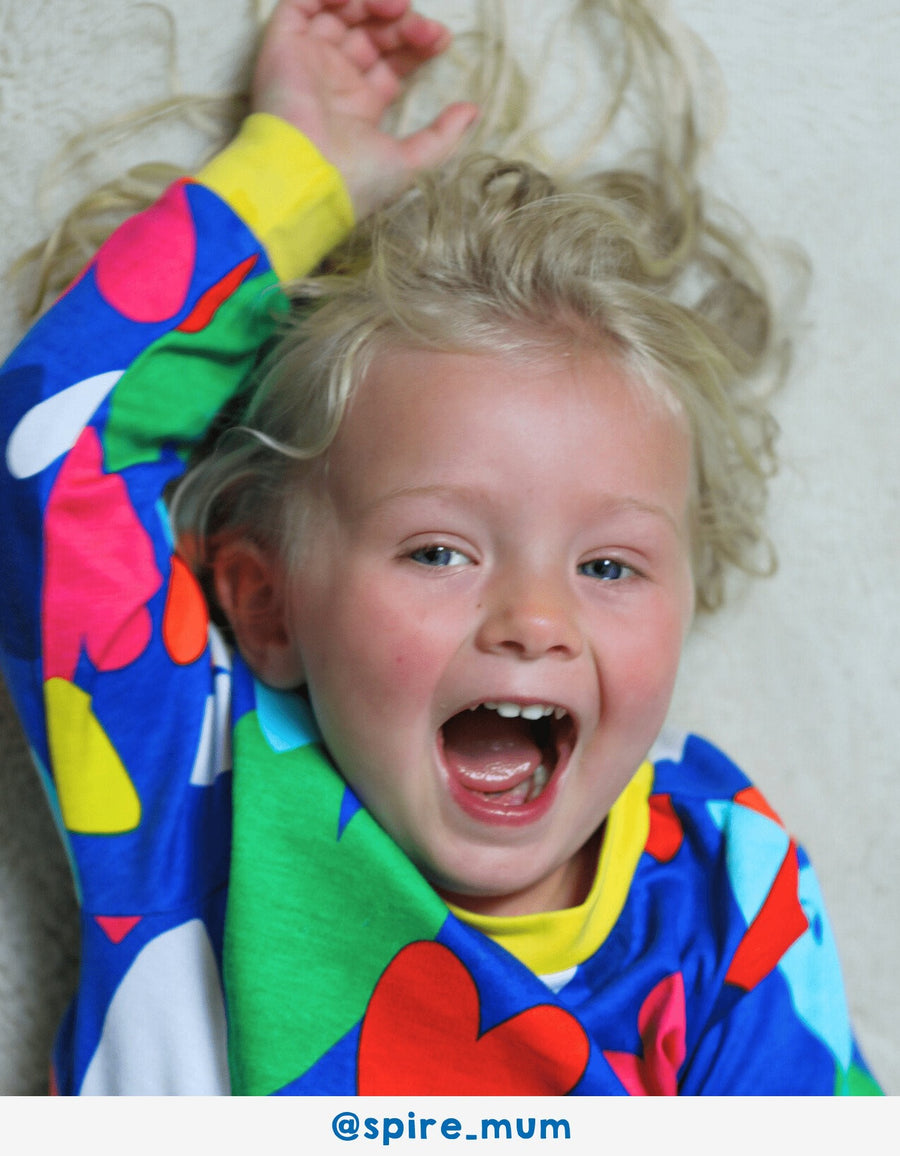 Luxury premium Toby Tiger sleepwear with hand-drawn heart print on light blue organic cotton, soft yellow trim, best-selling kids pajamas by Toby Tiger at brixbailey.com