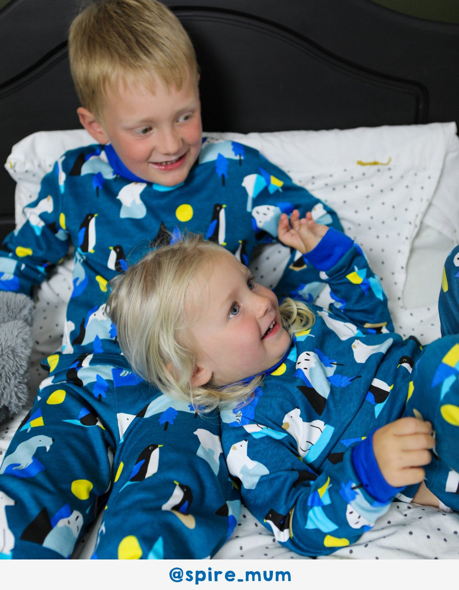 Premium organic cotton kids pajamas with arctic animal print, cozy blue penguin walrus polar bear design, soft GOTS certified sleepwear by Toby Tiger at brixbailey.com