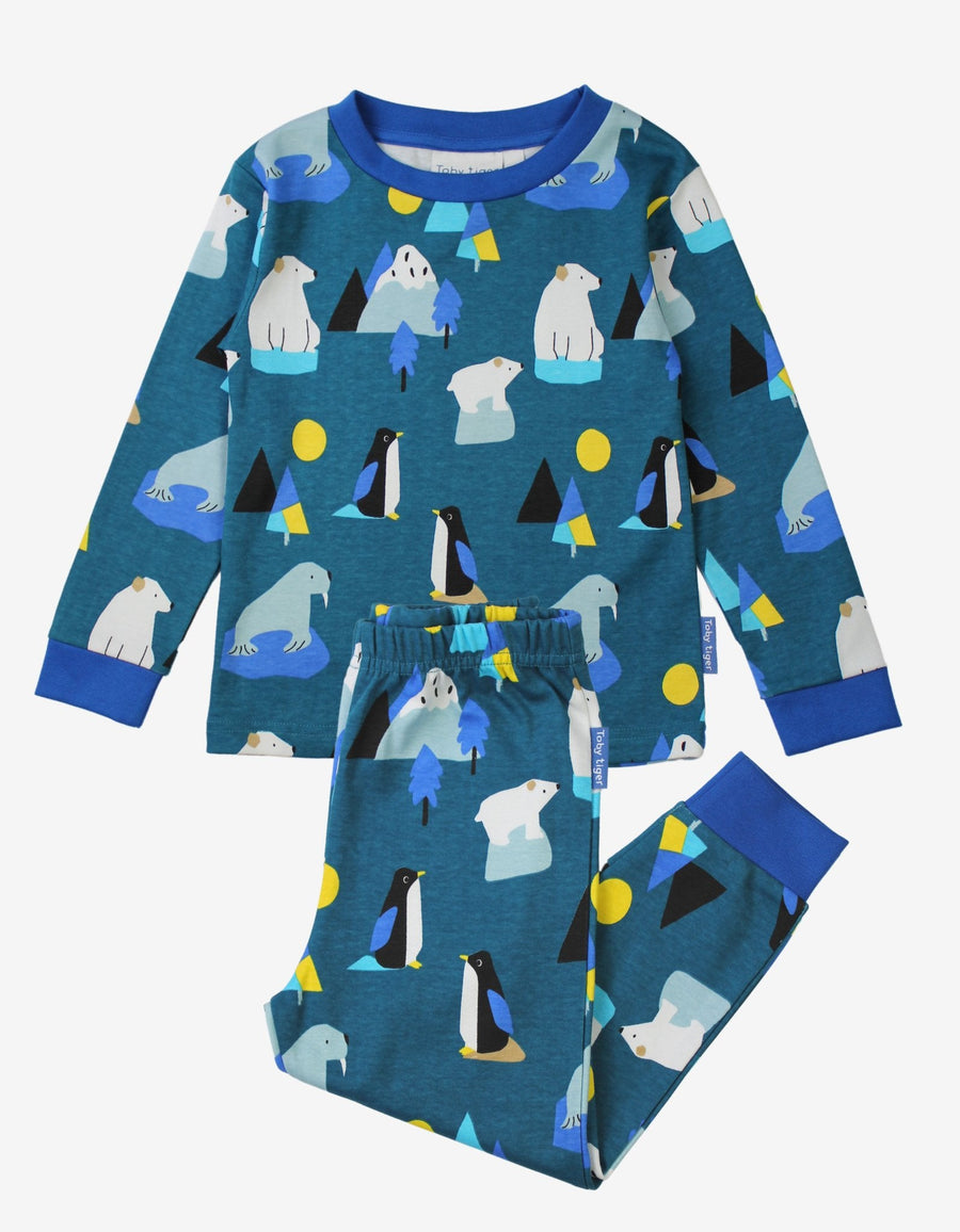 Premium kids organic cotton pajama set with arctic animal print, cozy blue penguin walrus polar bear design, soft GOTS certified sleepwear by Toby Tiger at brixbailey.com