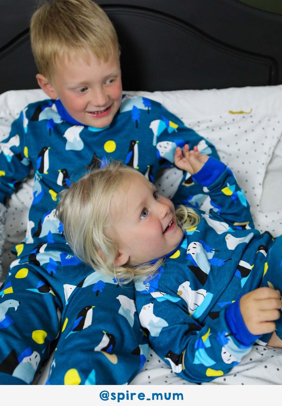 Premium organic cotton kids pajamas with arctic animal print, cozy blue Toby Tiger design, soft GOTS certified fabric, machine washable by Toby Tiger at brixbailey.com