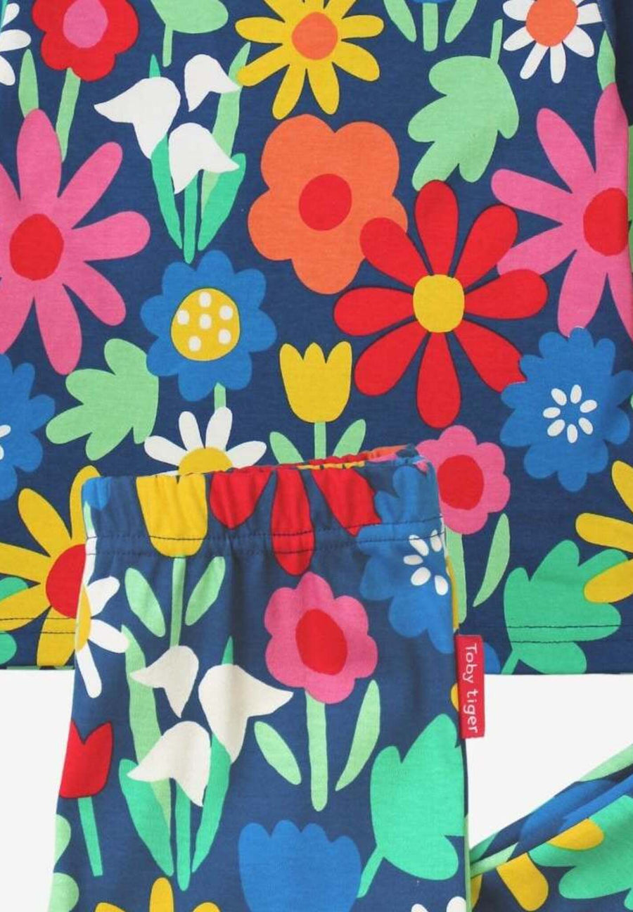 Premium organic cotton kids pajamas with floral snowdrop daisy tulip print on dark blue by Toby Tiger at brixbailey.com