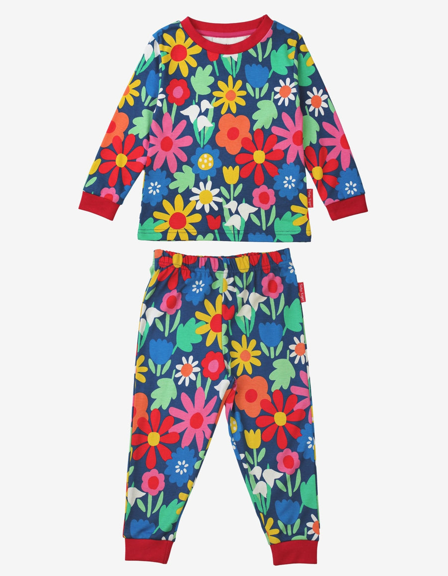 Premium organic cotton pajamas with floral print, stylish dark blue sleepwear with snowdrops, daisies, and tulips, soft and cozy kids pajama set by Toby Tiger at brixbailey.com