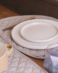 Premium organic cotton quilted table runner pair, stylish chambray weave, luxury dining decor, best-selling modern table setting by Karpāsa London at brixbailey.com