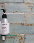 Luxury nourishing shampoo with bergamot, geranium, and orange peel oil for strong, healthy, revitalized hair by Dot & Lola at brixbailey.com