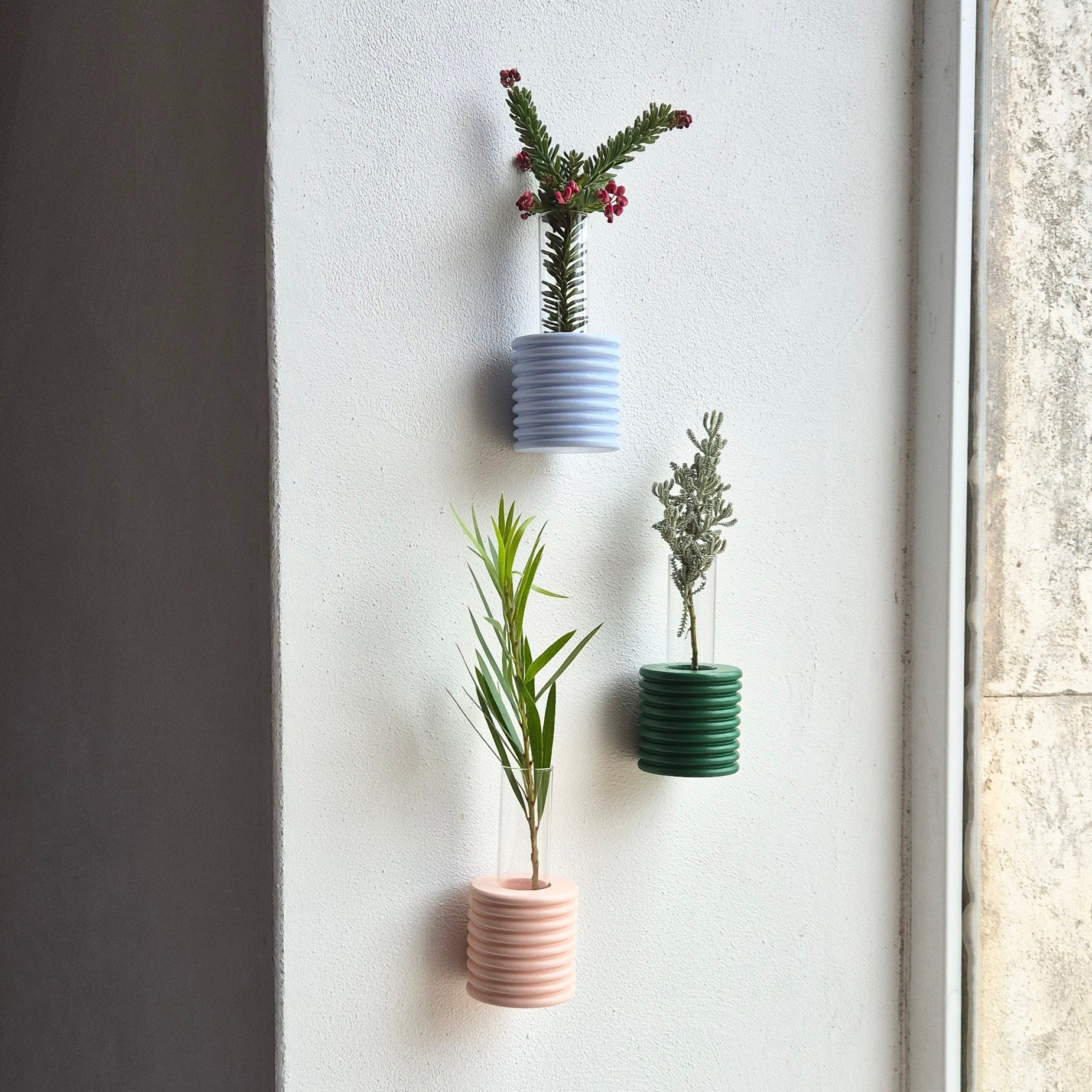 elegant light blue ribble wall vase in soft morning light, showcasing its refined artisanal craftsmanship