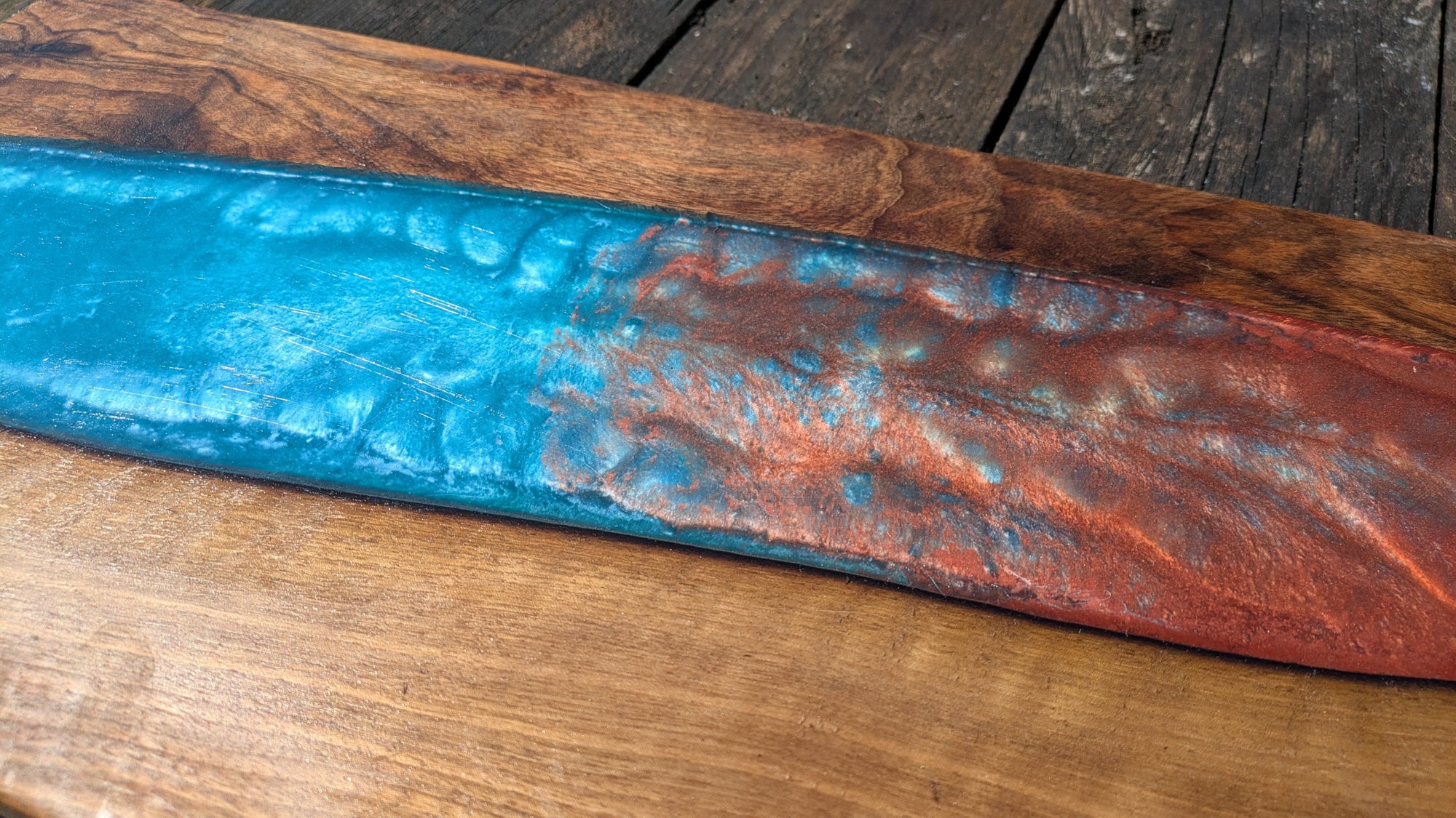 Walnut striking blue and bronze river board