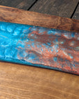 Walnut striking blue and bronze river board